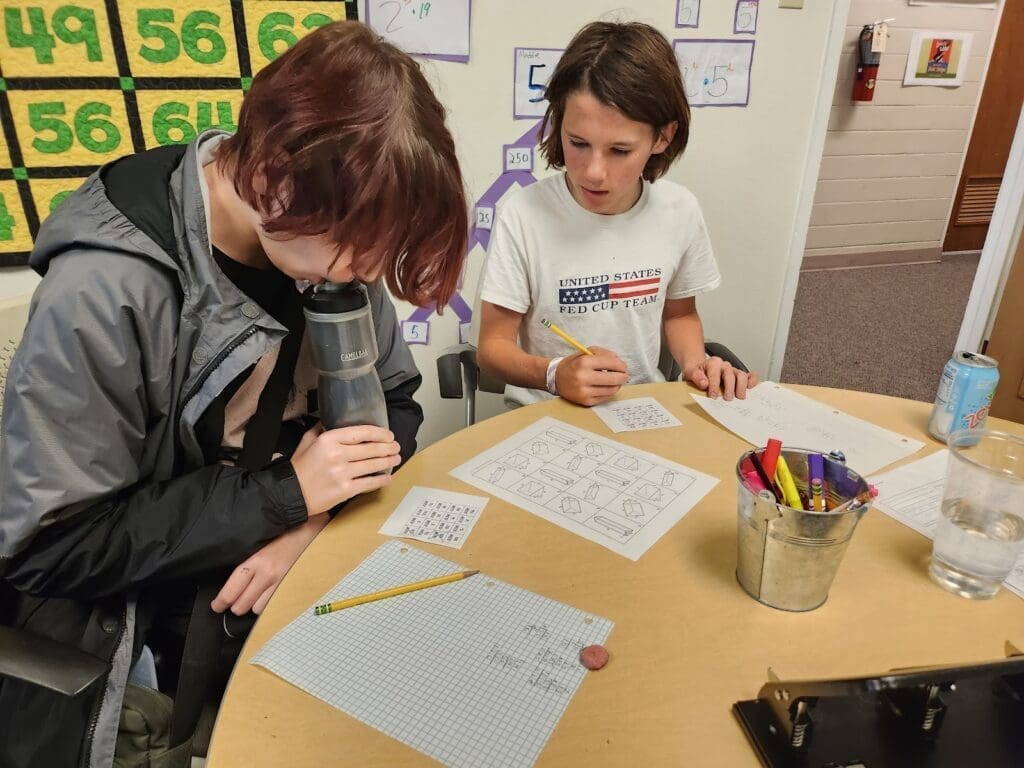 Students work on math assignment at progressive school.