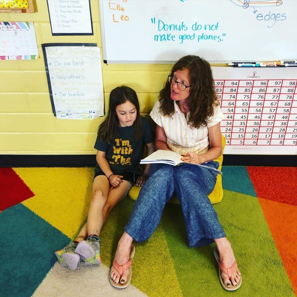 Student works individually with teacher at school that focuses on SEL.