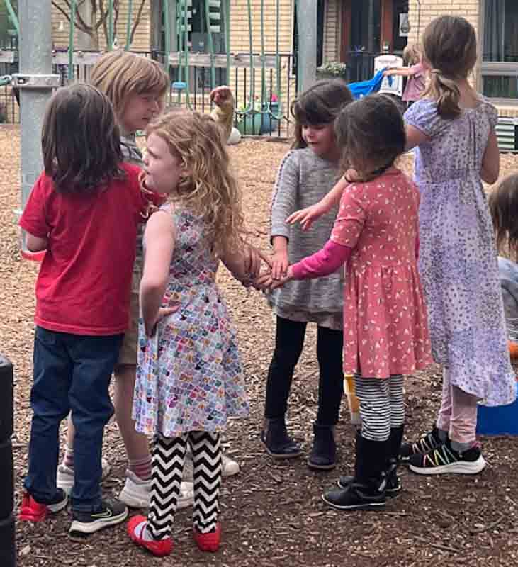 Kinder and first grade kids play together at recess at micro school.