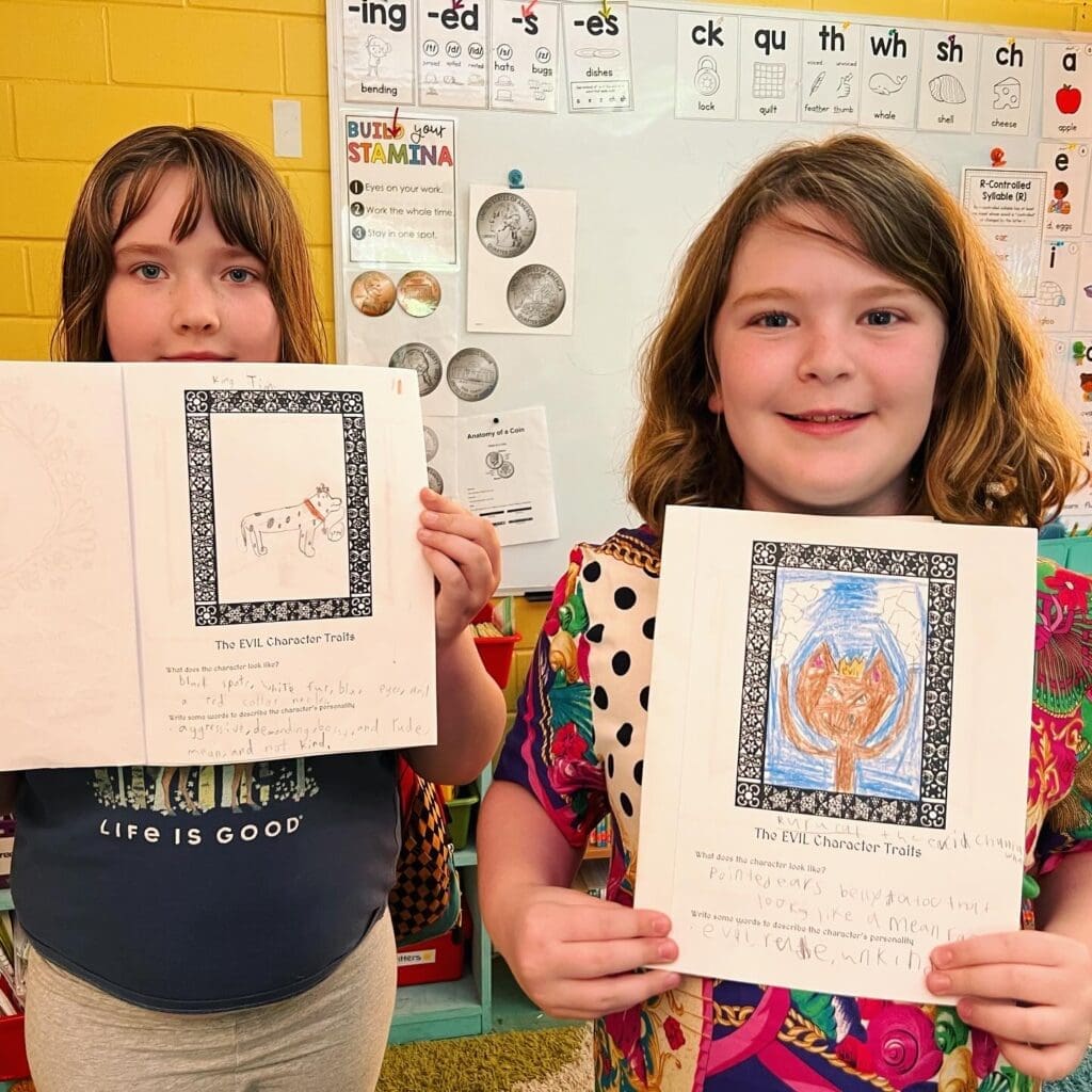 Third grade students proudly show off work at GT school.