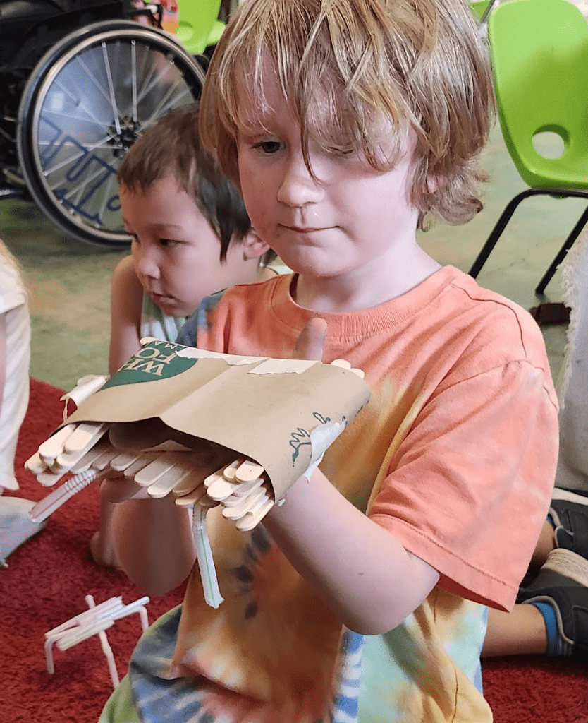 Kindergarten students work on projects at STEM school.