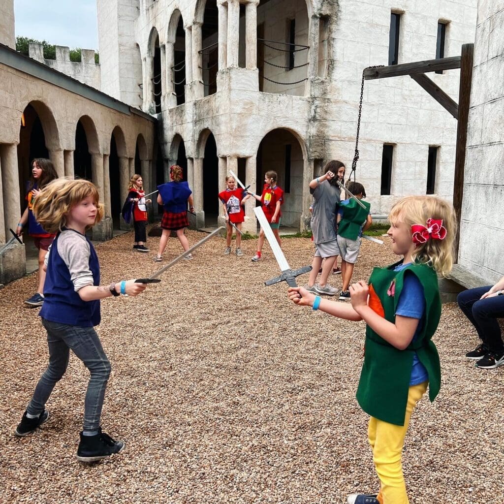 Second grade students visit castle as part of Medieval study at project based school.