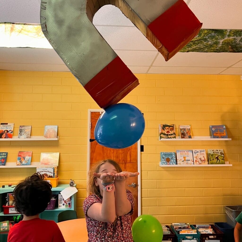 Third grade student tests static electricity at project based school.