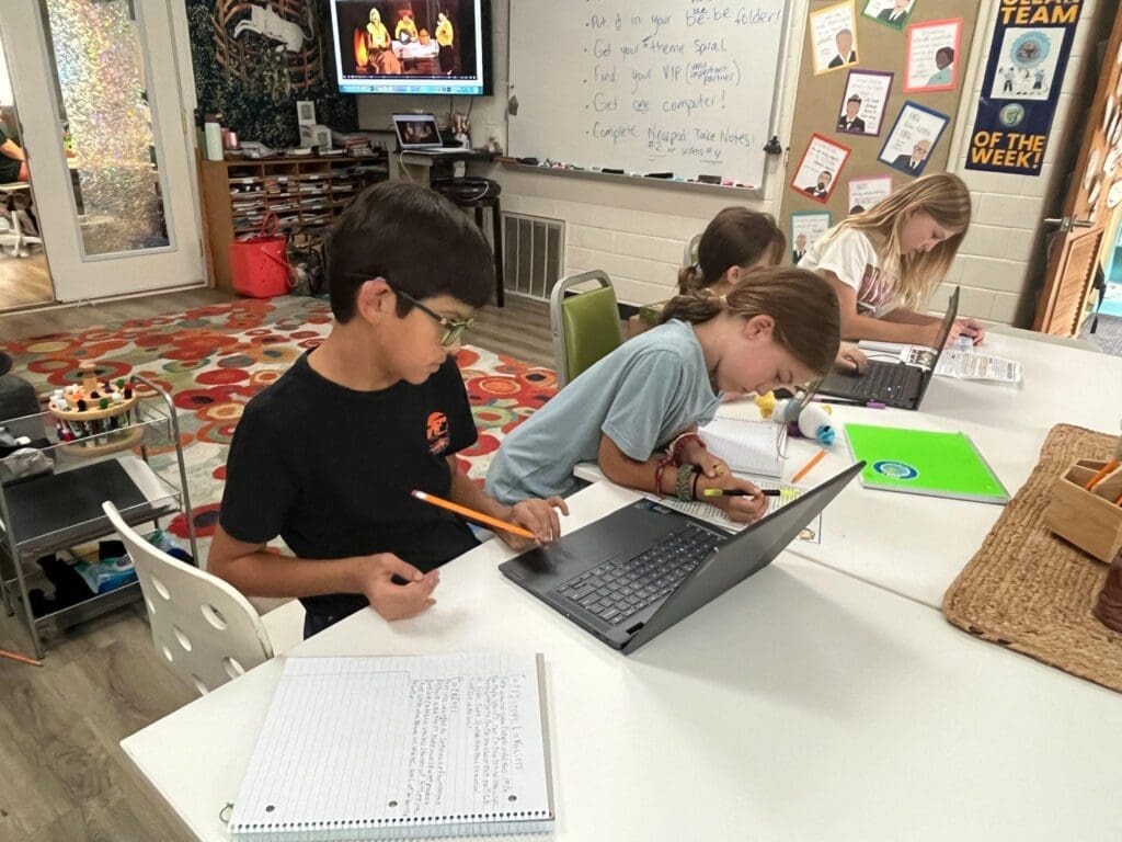 Fourth grade student works on computer at STEM school.