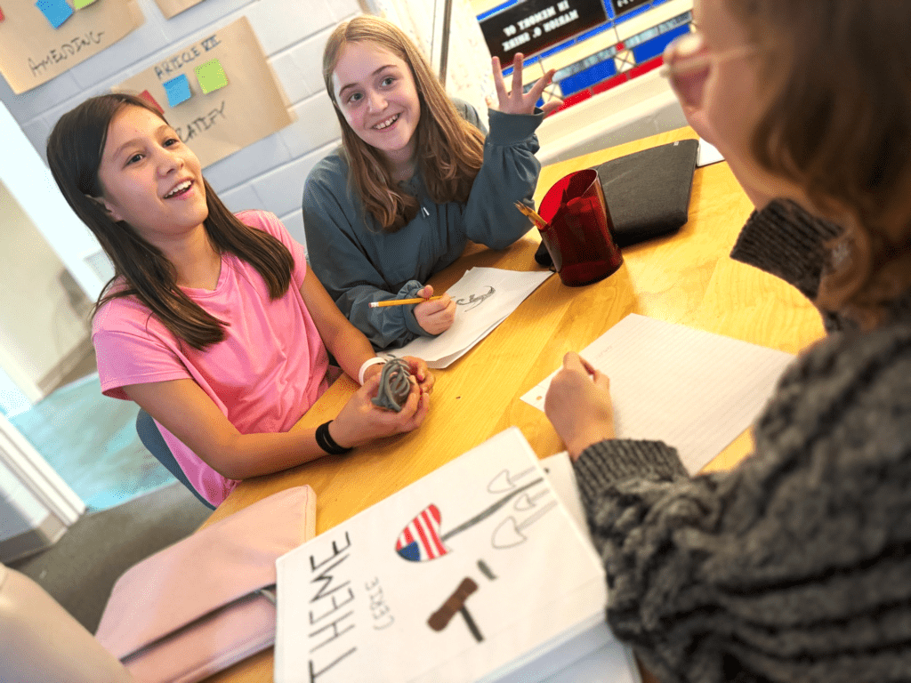 Three sixth graders work together at Austin middle school that focuses on SEL.