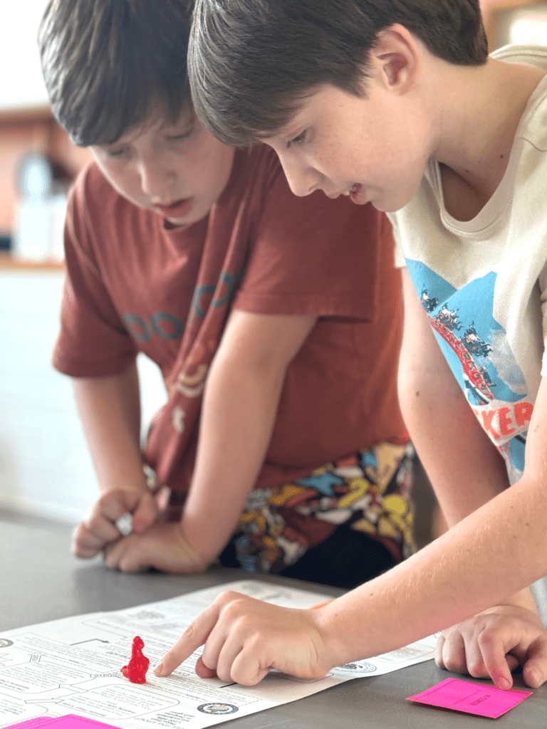 Two sixth grade students talk about reading project at progressive school.