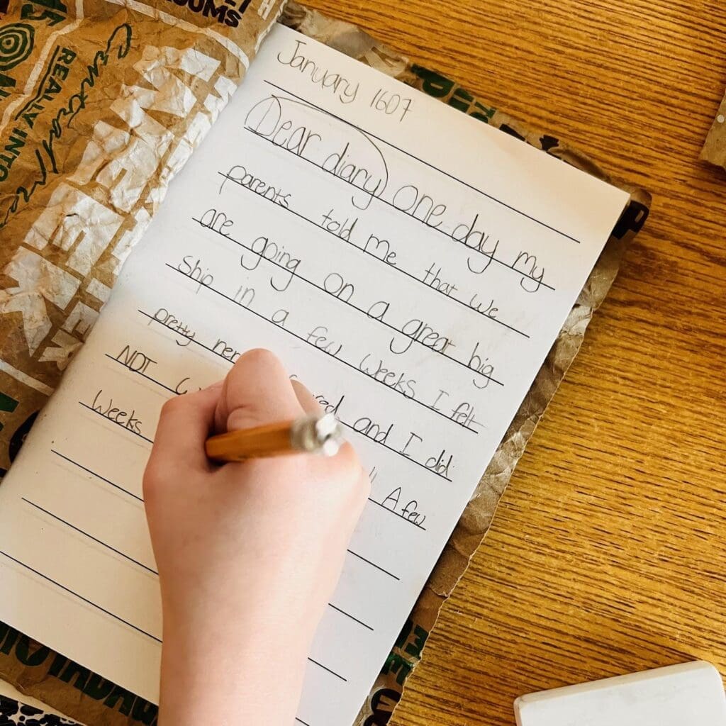 Second grader works on writing at micro school in Austin.