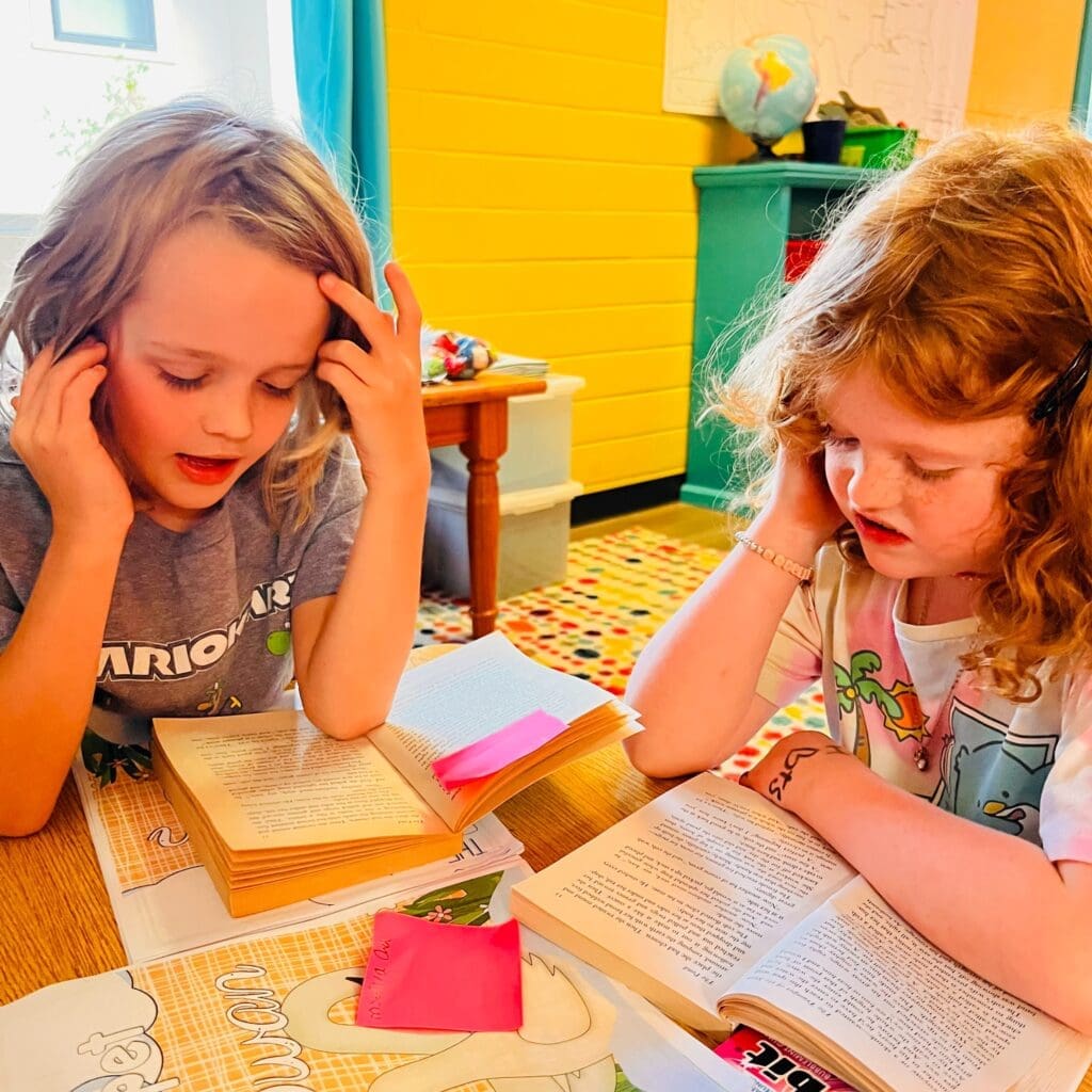 Two second grade students read together at GT school.