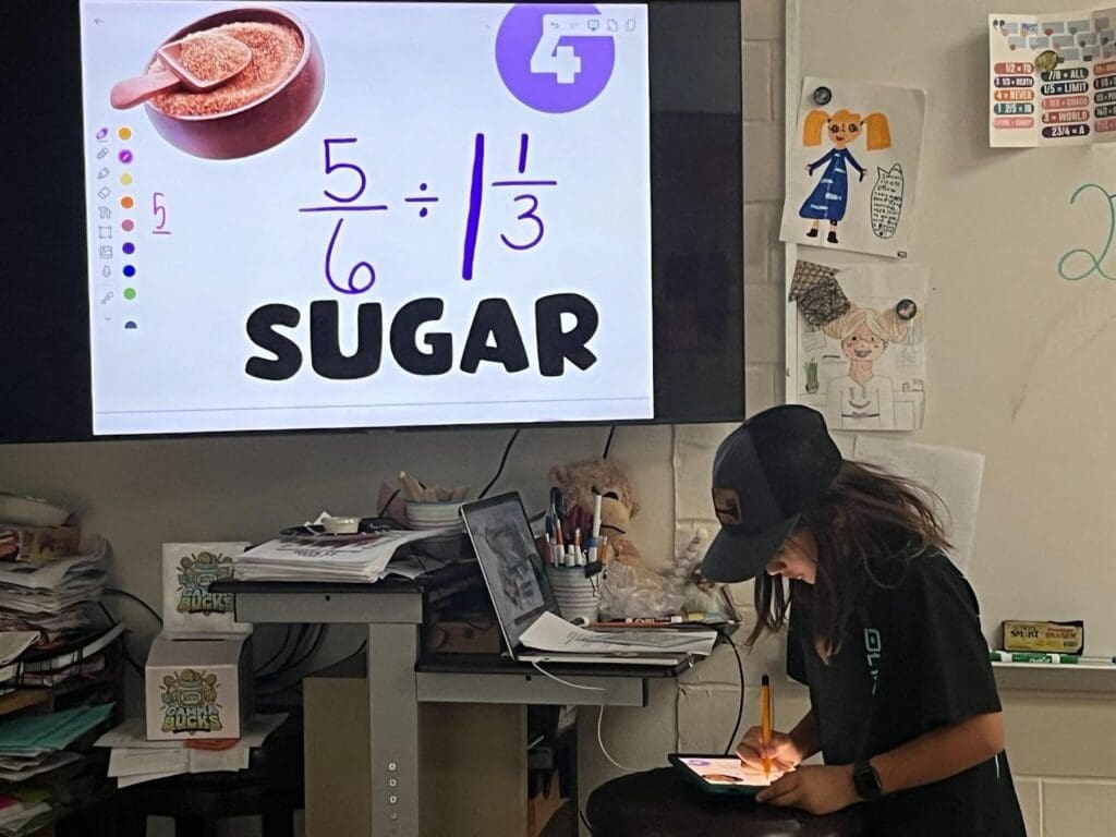 Fifth grade student works on math problem at screen at micro school in Austin.