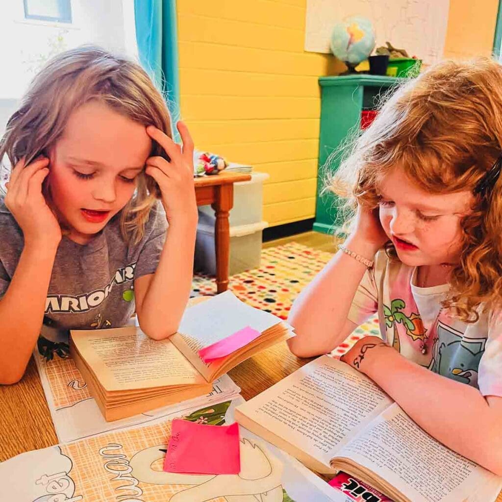 Two second graders read together at GT school.