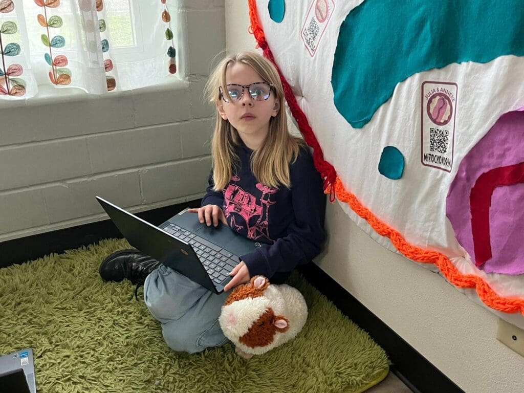 Elementary student working on computer at STEM school in Austin.