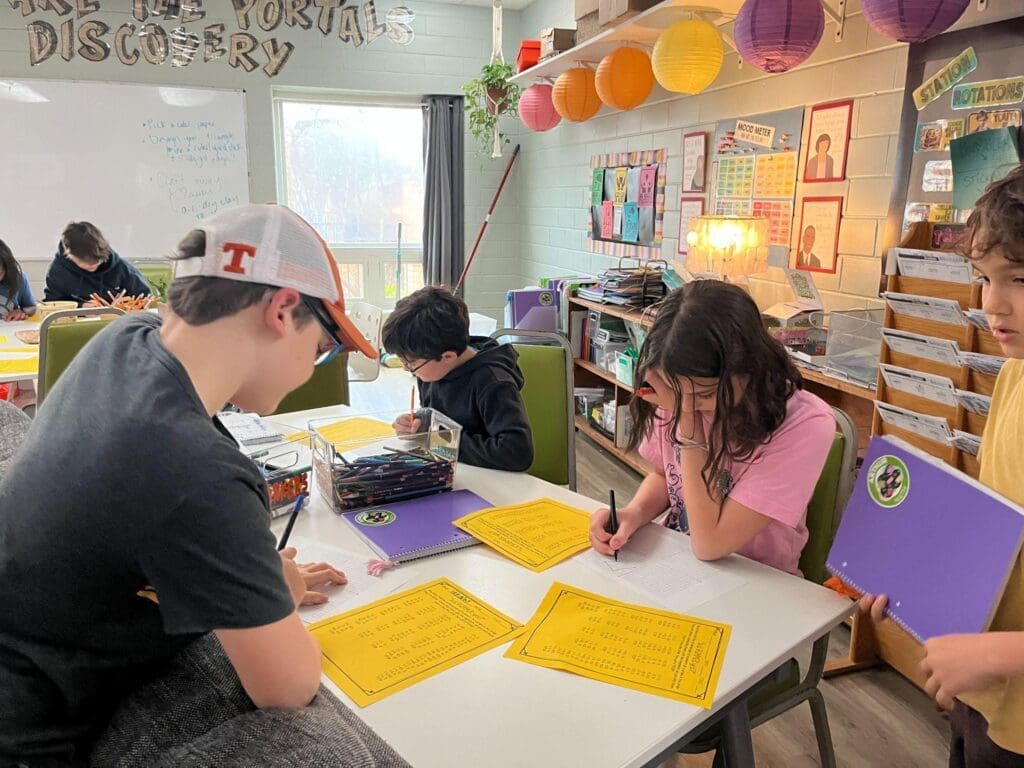 Elementary students work on math at table at GT school in Austin.