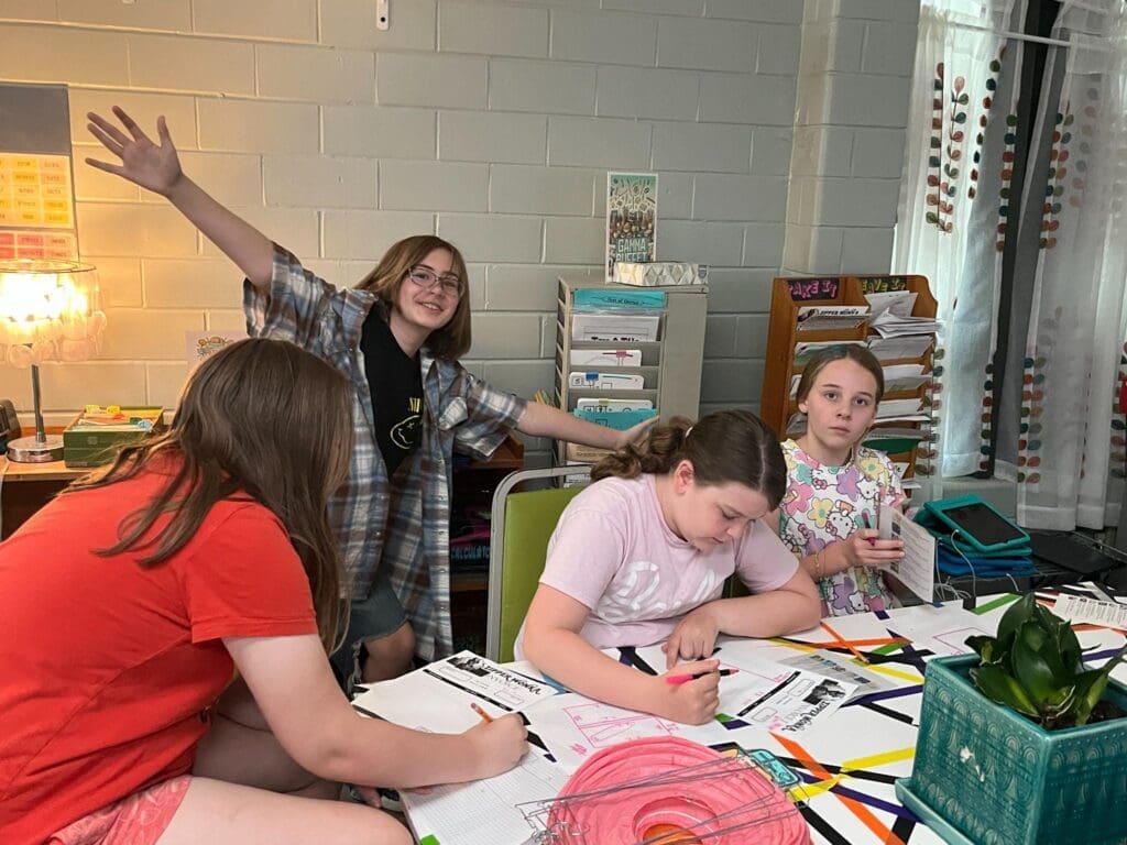 Elementary students work together at private school with small classes.