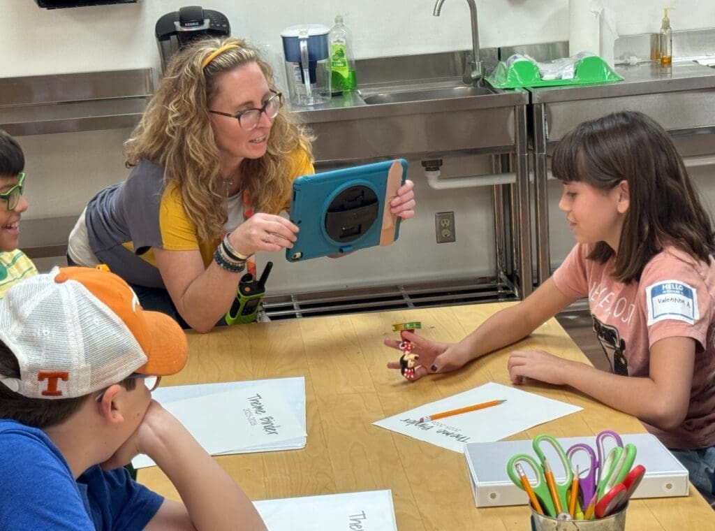 Teacher uses iPad as part of assignment at STEM school.