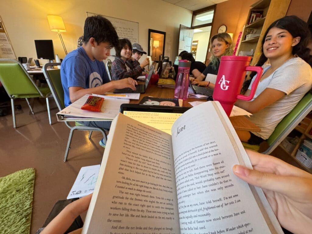 Middle school students discuss book at gifted school in Austin.