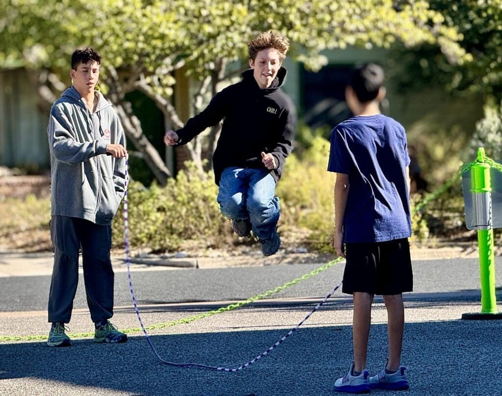 Middle schoolers jump rope at private school.