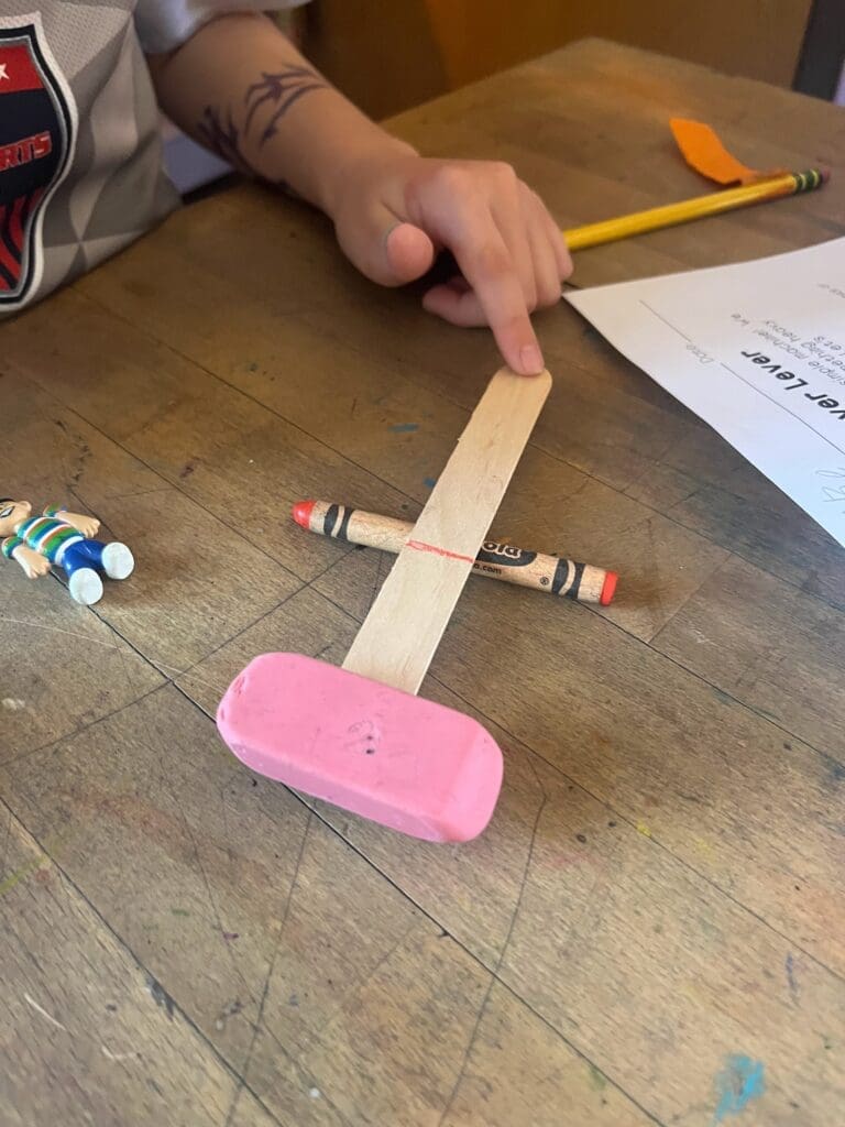 Elementary student creates lever at STEM school in Austin.