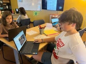 Middle school students work on computers at private school in Austin.