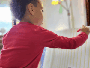 Kindergarten student work on math at private school in Austin