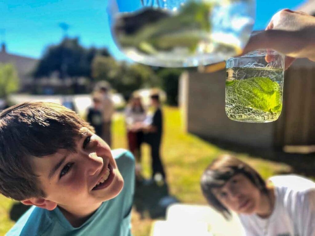 Middle school students look at science project at STEM school in Austin.