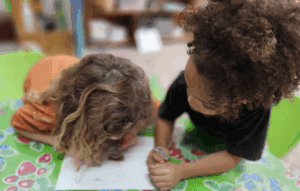 Two kindergarten students work together at micro school