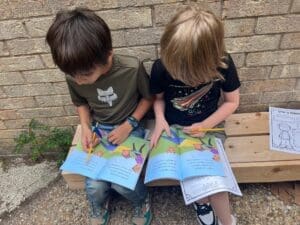 Two elementary students read together at private school in Austin.
