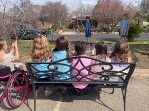 Elementary students perform at recess at school with small classes.