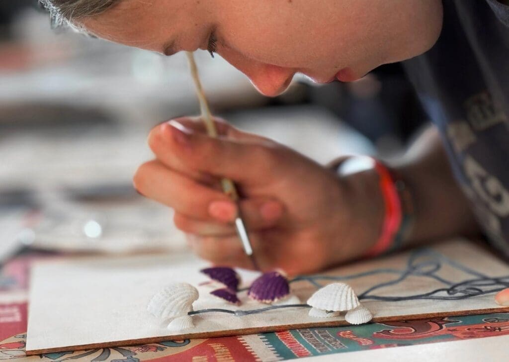 Middle school student paints at private school in Austin.