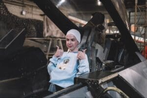 Middle school student sits in cockpit at history museum on private school field trip.