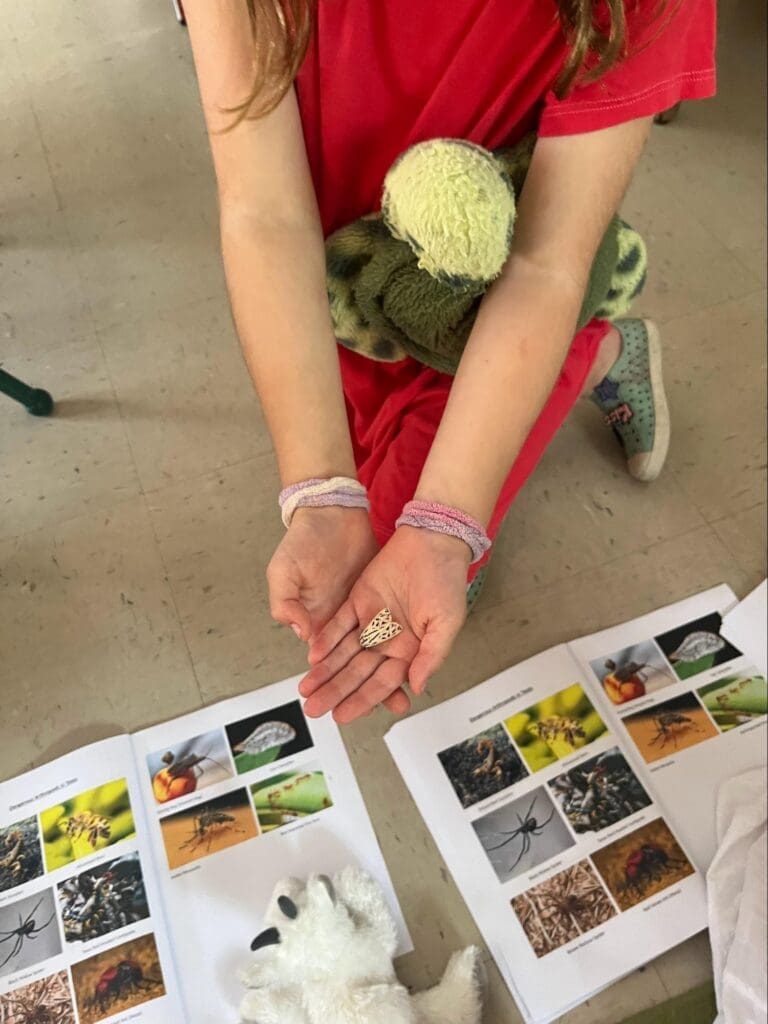 Elementary student works with plants at project based school.