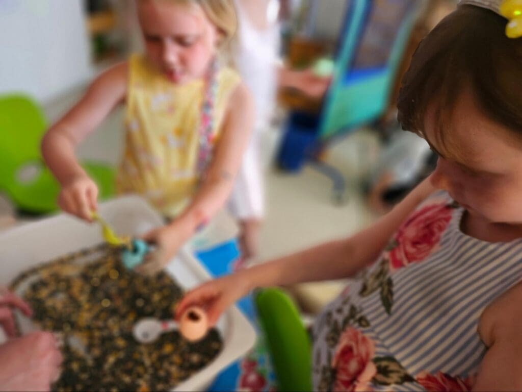 Two kindergarten students make cascarones at project based school in Austin.