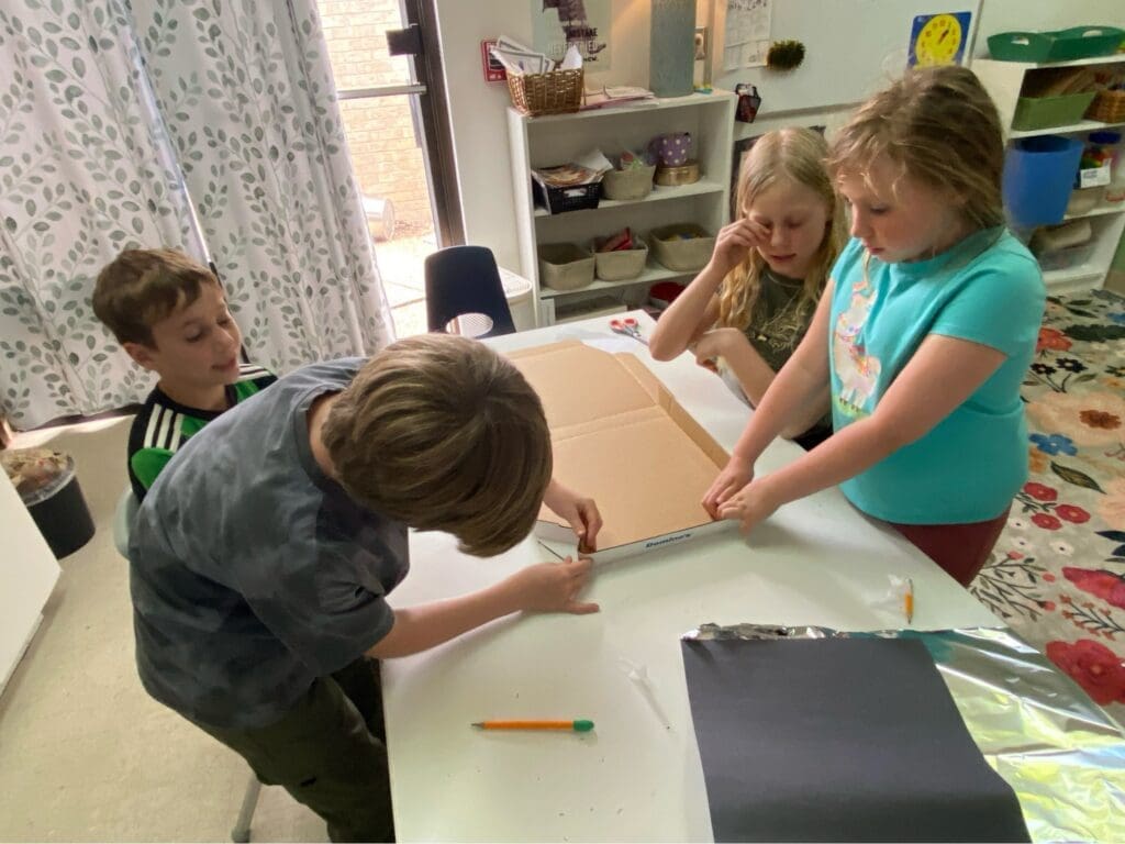 Elementary students work together at micro school.