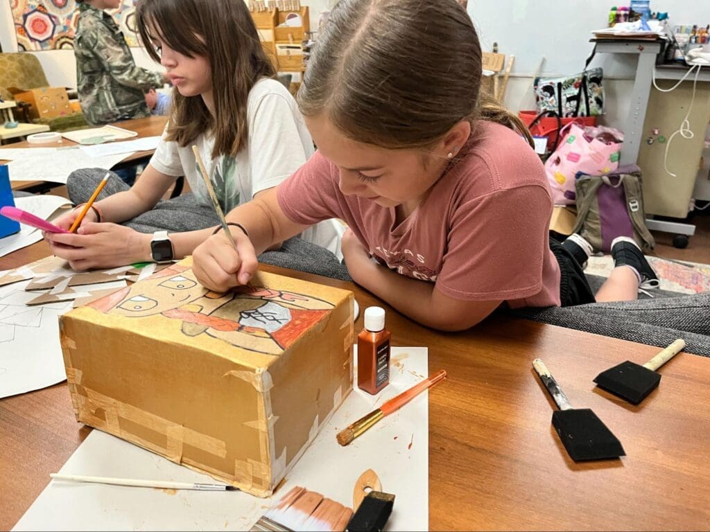 Middle school student works on project at micro school.